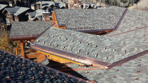 The concrete tile roof and poorly ventilated deck were causing major problems for the building owner, not to mention the residents who live and rent there. Heat was escaping through the roof, causing the snow to melt and refreeze at the eaves.