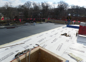 The roof systems incorporate multiple layers of polyiso insulation—a base layer of 6 inches and then tapered insulation on top of that for an average R-80.