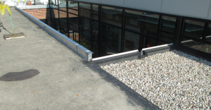 Note how nicely a prefabricated roof curb quickly and structurally raises the roof edge to accommodate new roof insulation.
