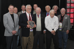 Gooding is surrounded by previous J.A. Piper Award winners.