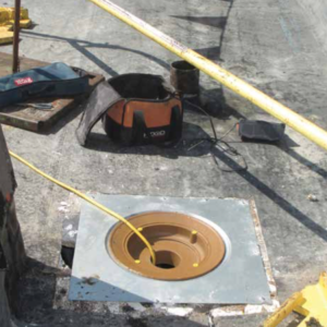 PHOTO 1: Roof drains should be set into a sump receiver provided and installed by the plumbing contractor.
