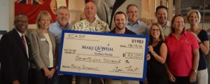 Members of RCASF’s Fishing Tournament Committee donate $75,000 to Norm Wedderburn (far left), CEO and president, and Wanda Trouba (second from left), vice president, of the Make-a-Wish Foundation.