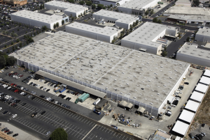 This photo shows the American International Industries roof before work began on the restoration project. The roof diaphragm on the 210,000-square-foot, wood-frame manufacturing facility in Los Angeles had deflection caused by structural settlement. Photo courtesy of Highland Commercial Roofing.
