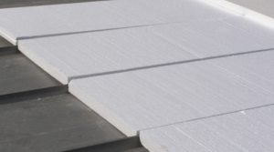 Flute fill insulation helps reduce labor costs on re-covers of standing seam metal roofs.