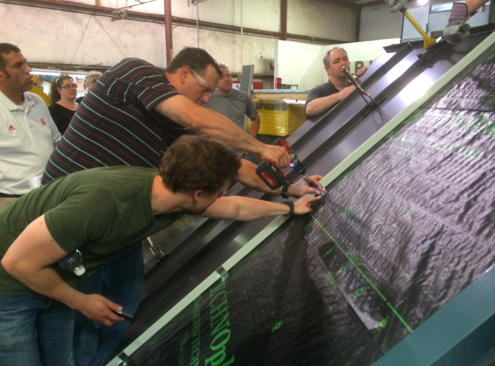 During the Spring Fling, a hands-on training session took place for the N.B. Handy roofing staff and the employees of N.B. Handy's subsidiary company Morris Ginsberg