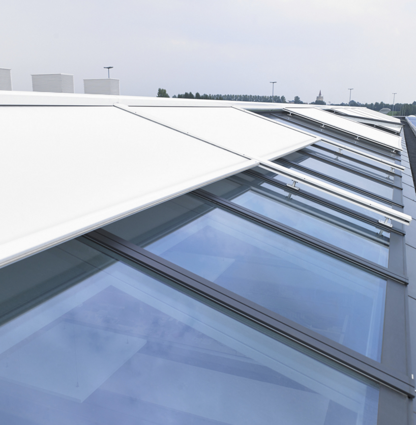 VELUX and RENSON have introduced Topfix VMS, a motor-operated sunscreen with special mounting feet engineered for fixed and movable VELUX Modular Skylights.
