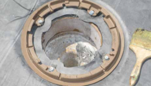 PHOTO 4: The roof drain extension ring can be seen and the top surface of the roof membrane is above the clamping ring, thus preventing ponding at the roof drain because of the thickness of the clamping ring.