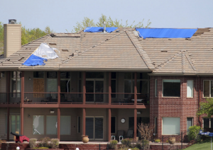 a powerful microburst with winds reaching up to 100 mph destroyed a bulk of the roofs in the subdivision