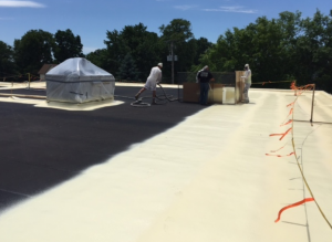 The existing roof experienced areas of ponding water that were remedied with spray foam that created a slope toward drains.
