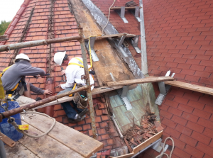 As the clay-tile roof covering was removed, the materials of the substrate were revealed and conditions were assessed.