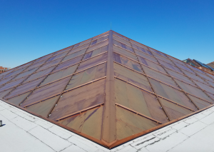 The design of the quilted flat lock copper panel system involved 17 different panel profiles. A false batten was added after the panels were in place. 